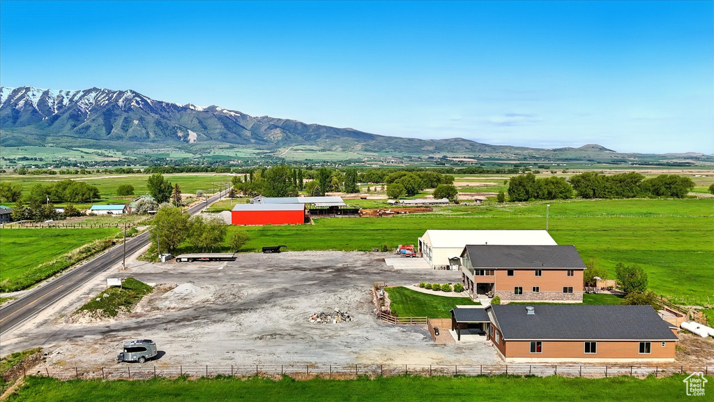 Overview of rural landscape featuring a mountain backdrop