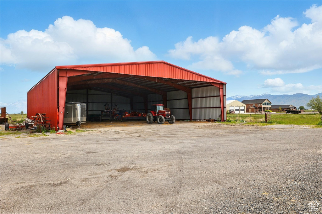 View of pole building featuring a carport and a mountain view