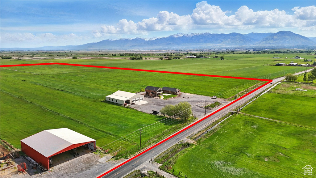 View of rural area featuring mountains and a pastoral area