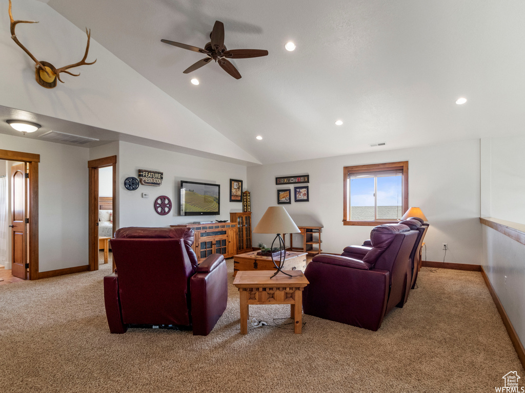 Living room with light carpet, recessed lighting, ceiling fan, baseboards, and lofted ceiling