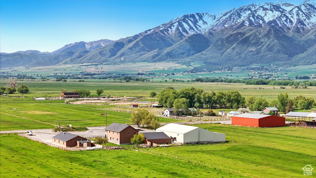 View of mountain backdrop with rural landscape and agricultural land