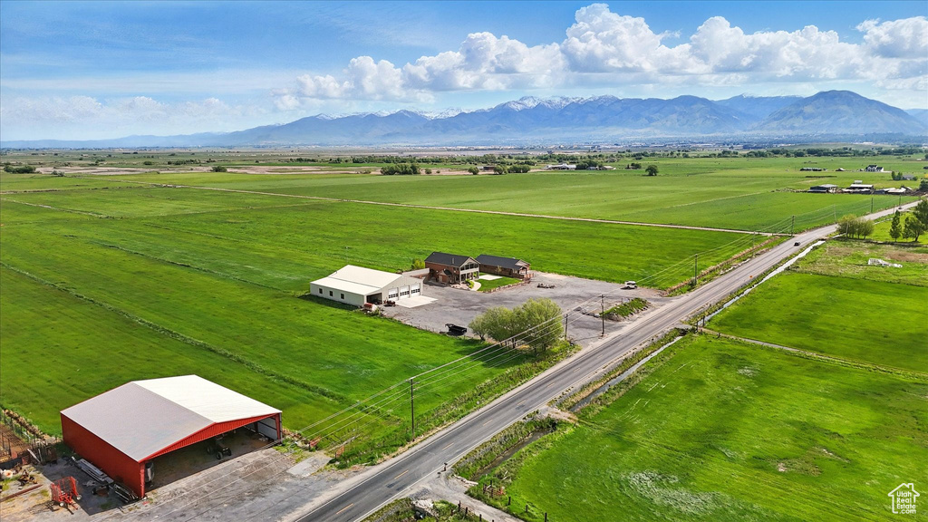 Aerial view of sparsely populated area with mountains and a pastoral area