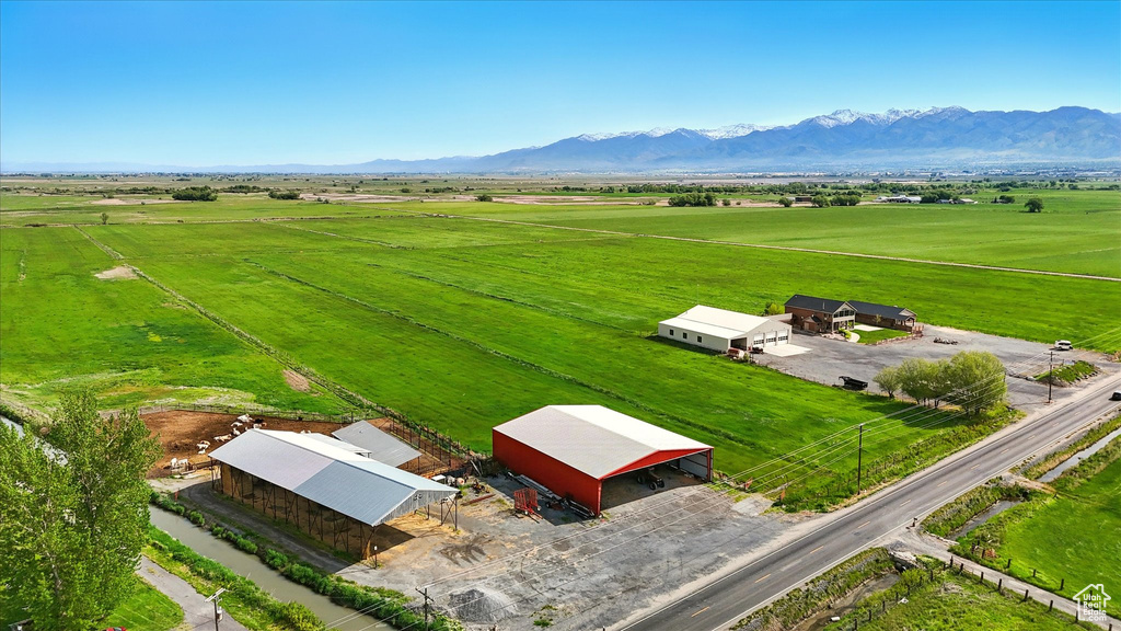 View of rural area featuring a mountain backdrop and a pastoral area