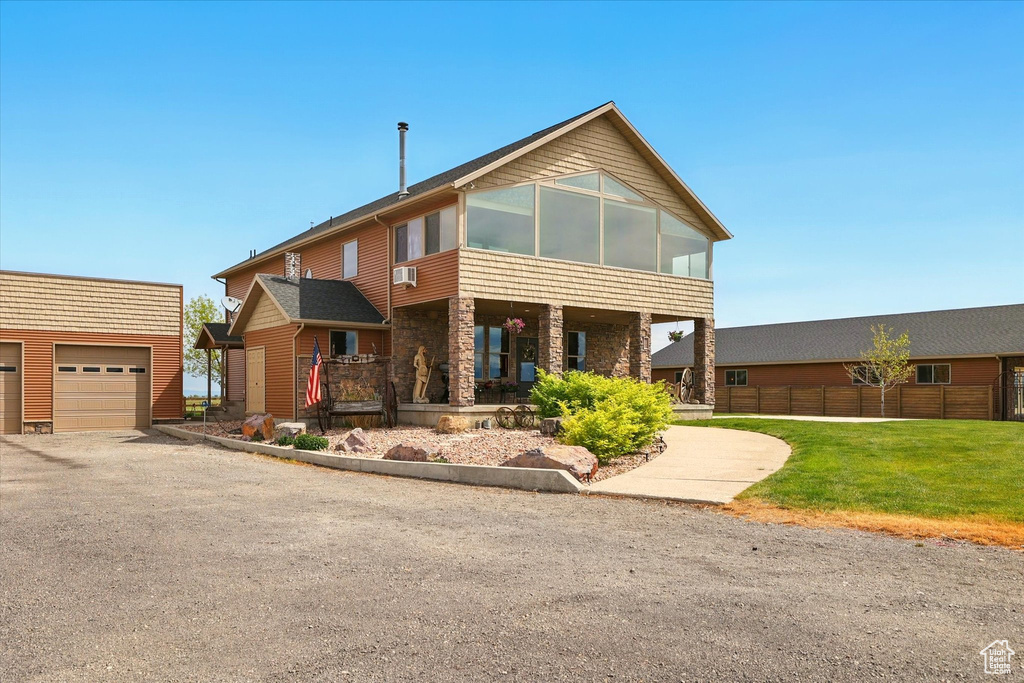 View of front of property with an outdoor structure