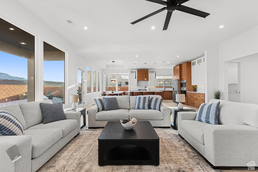 Living area featuring recessed lighting and ceiling fan