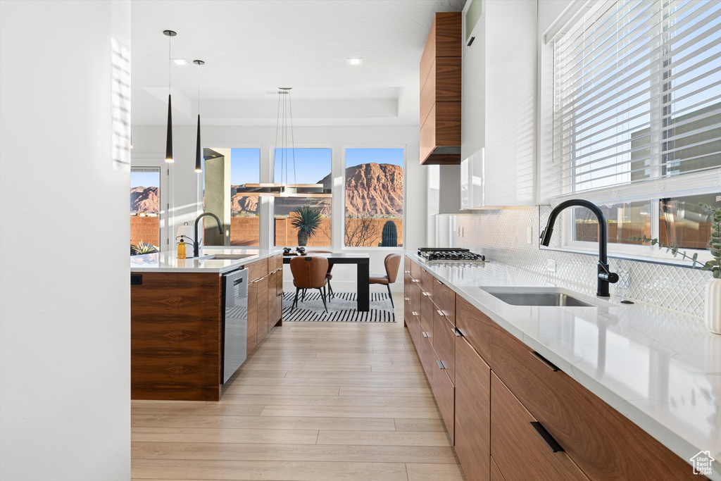 Kitchen featuring modern cabinets, a sink, and stainless steel appliances