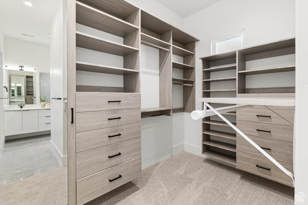 Walk in closet with a sink