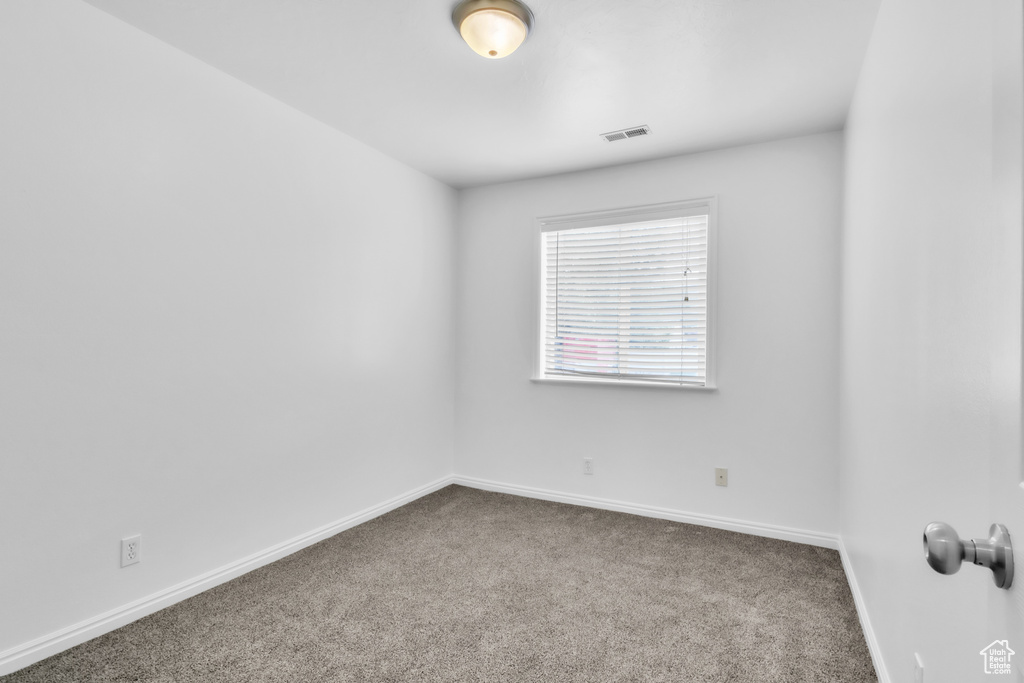 Spare room with carpet flooring and baseboards
