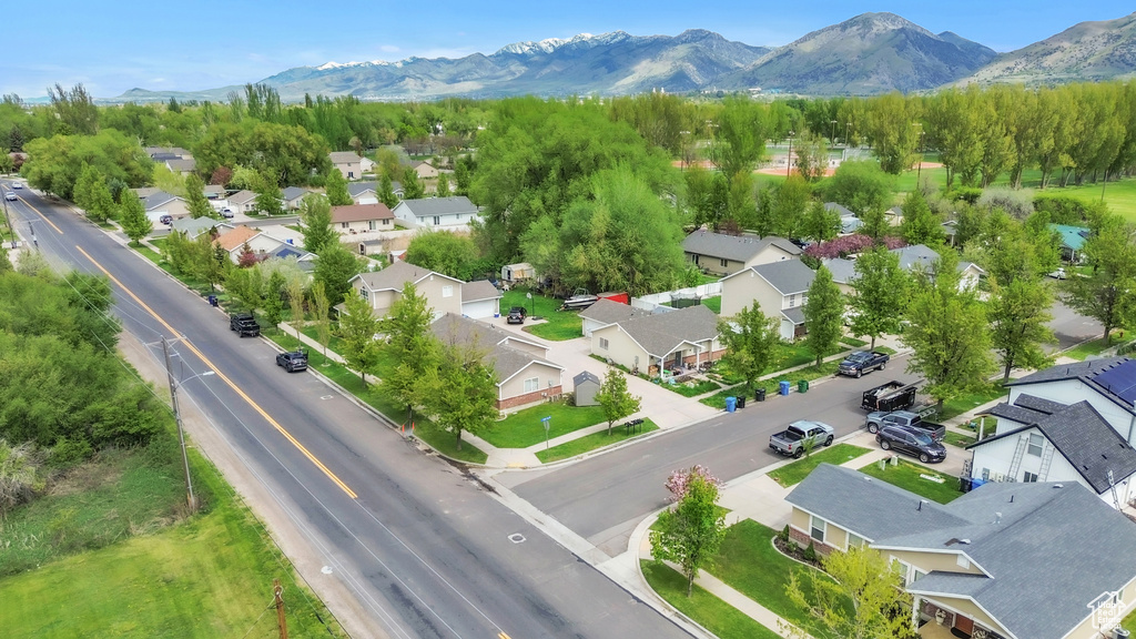 Aerial perspective of suburban area featuring a mountain backdrop