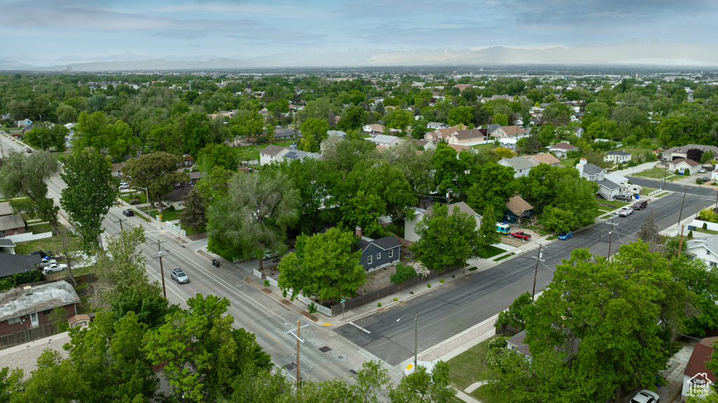 Aerial view of residential area featuring a mountainous background