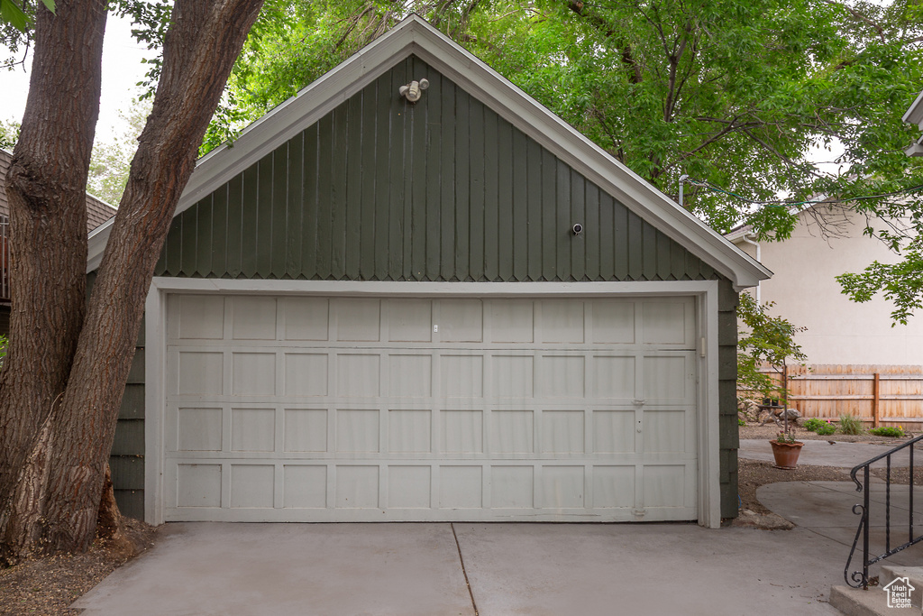 Detached garage featuring fence