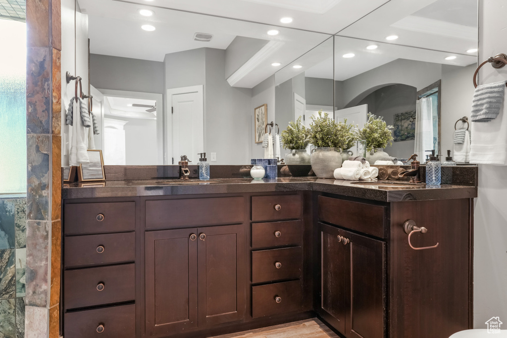 Bathroom featuring recessed lighting and double vanity