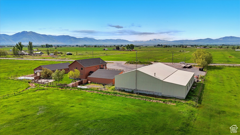 Aerial view of sparsely populated area with mountains and agricultural land