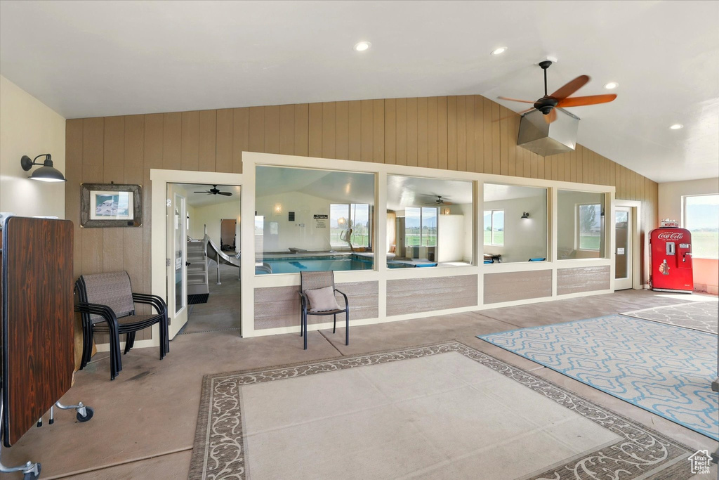 View of patio featuring ceiling fan and an indoor pool