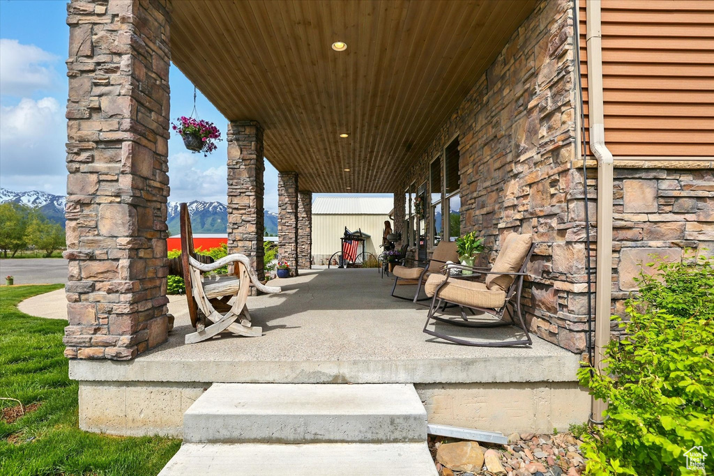 View of patio featuring covered porch and a mountain view