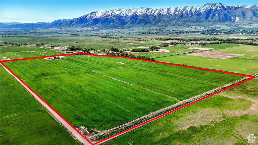 View of rural area with property parcel outlined and a mountain backdrop