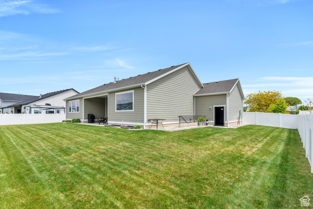 Rear view of house featuring a patio area