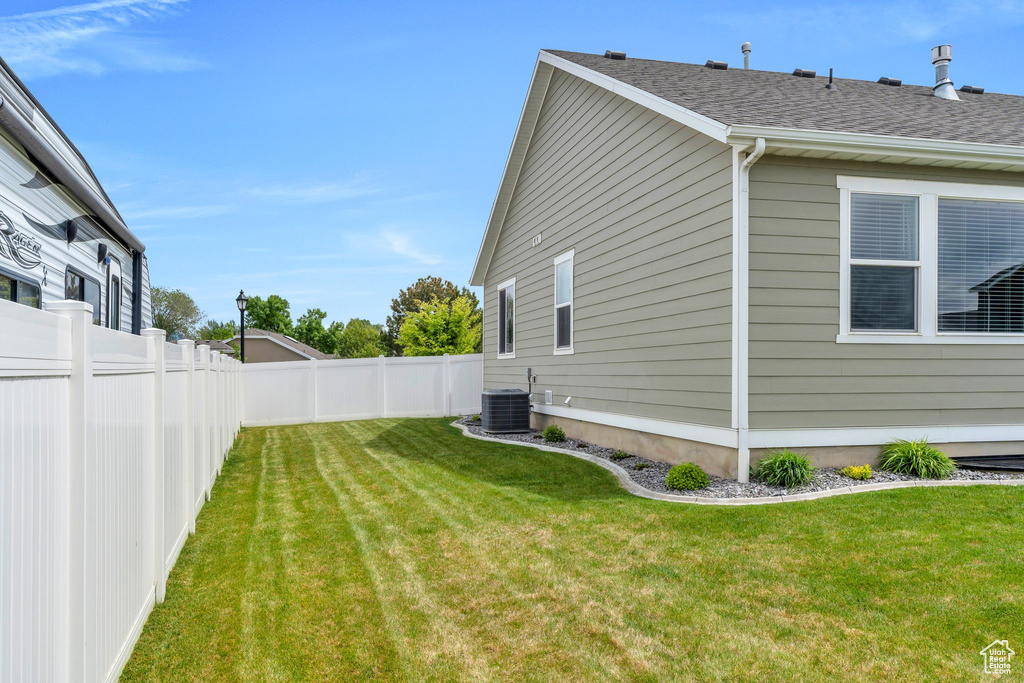 View of yard with central AC unit
