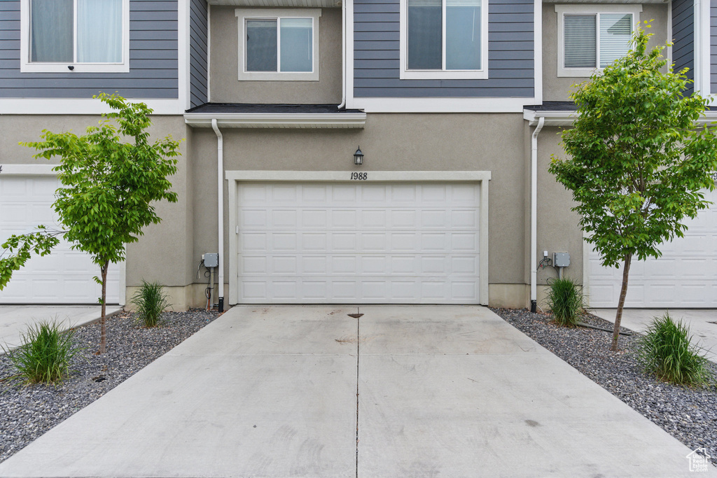 Garage with concrete driveway