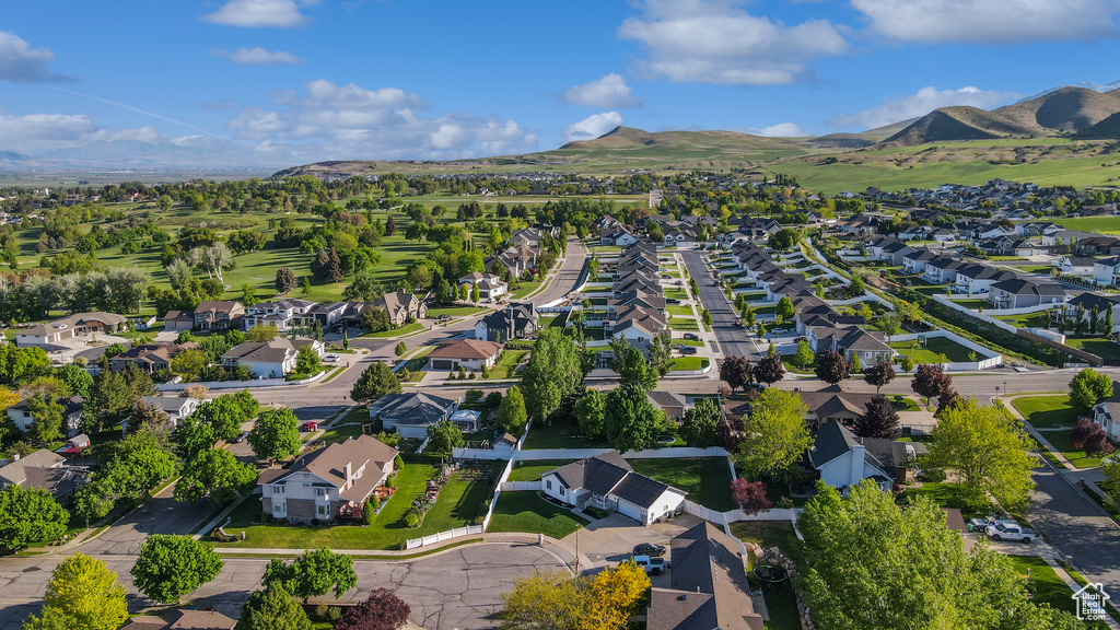 Aerial view of property\'s location with nearby suburban area and mountains