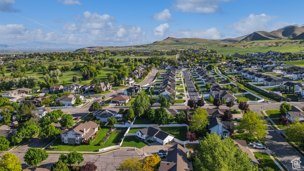 View of property location featuring nearby suburban area and a mountain backdrop