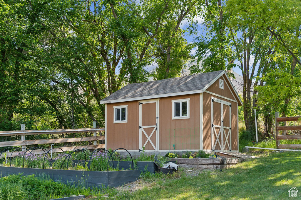 View of shed with a garden