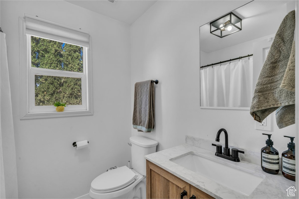Bathroom with toilet and vanity