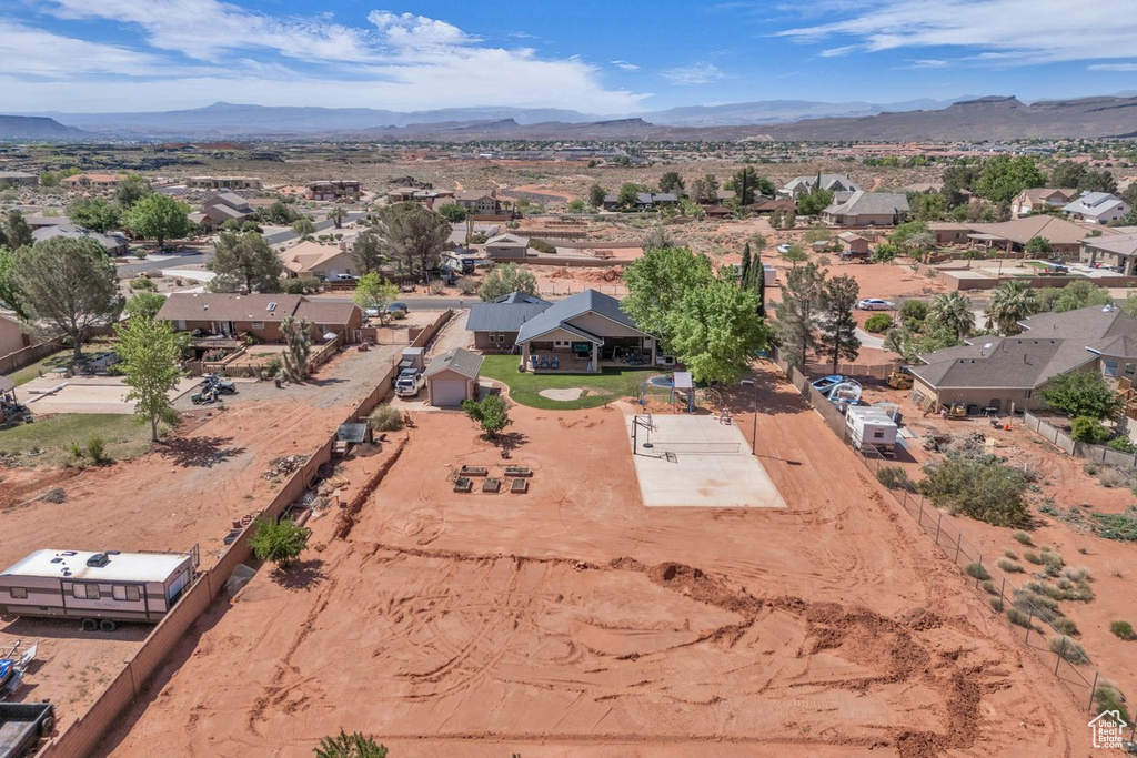 Aerial perspective of suburban area with a mountain backdrop