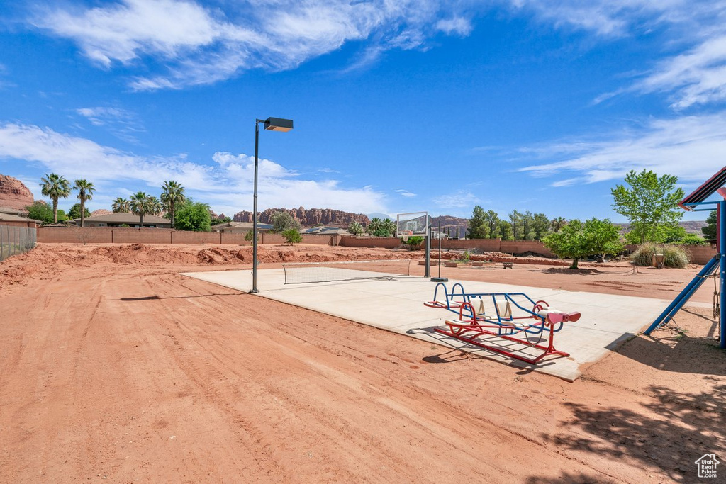 View of home's community featuring fence