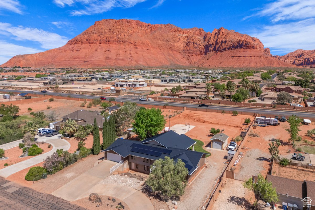 Aerial perspective of suburban area with a mountainous background