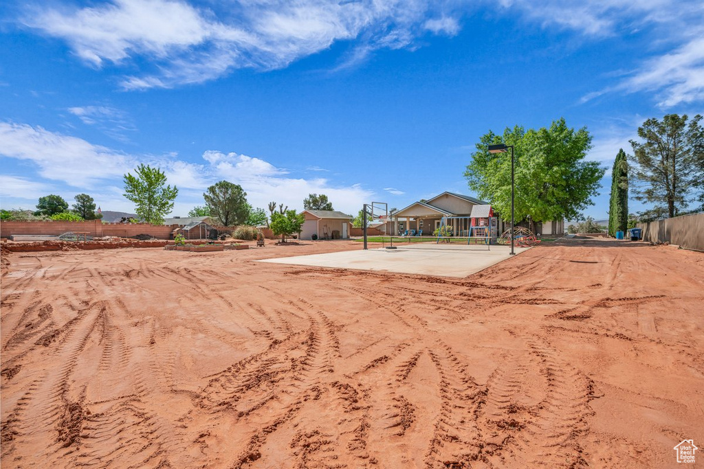 View of yard featuring fence