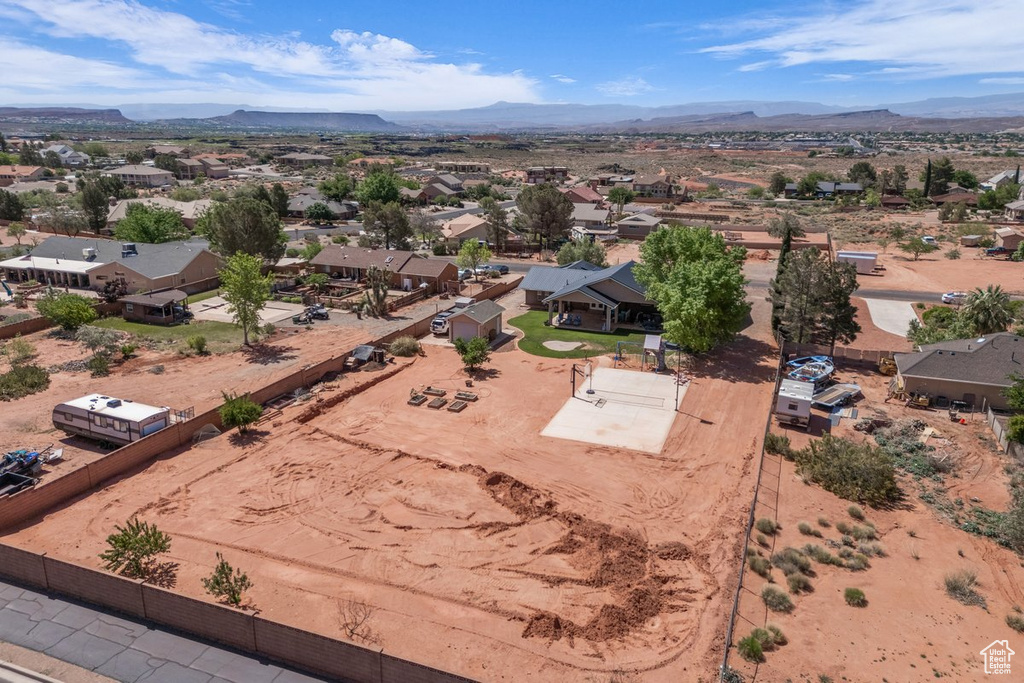 Aerial perspective of suburban area featuring a mountainous background