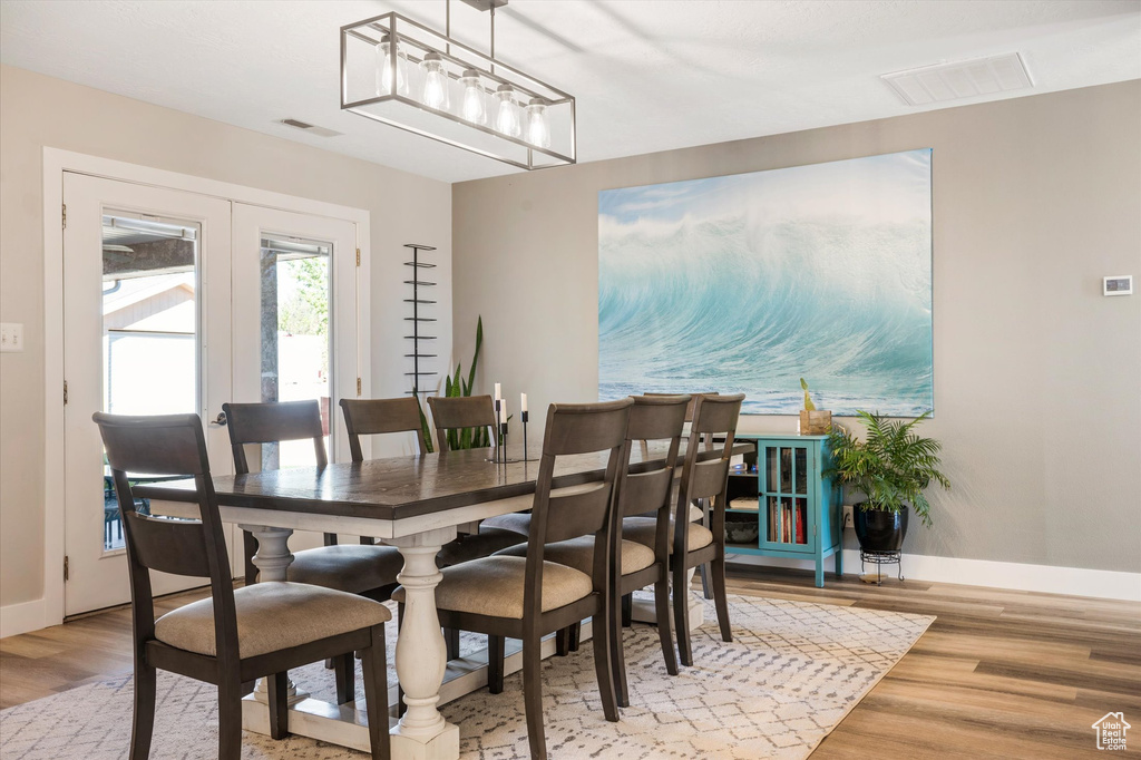 Dining room with wood finished floors and baseboards
