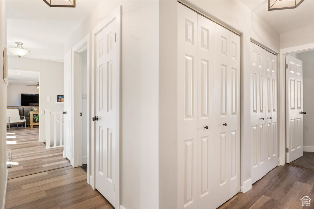 Hall featuring wood finished floors and baseboards