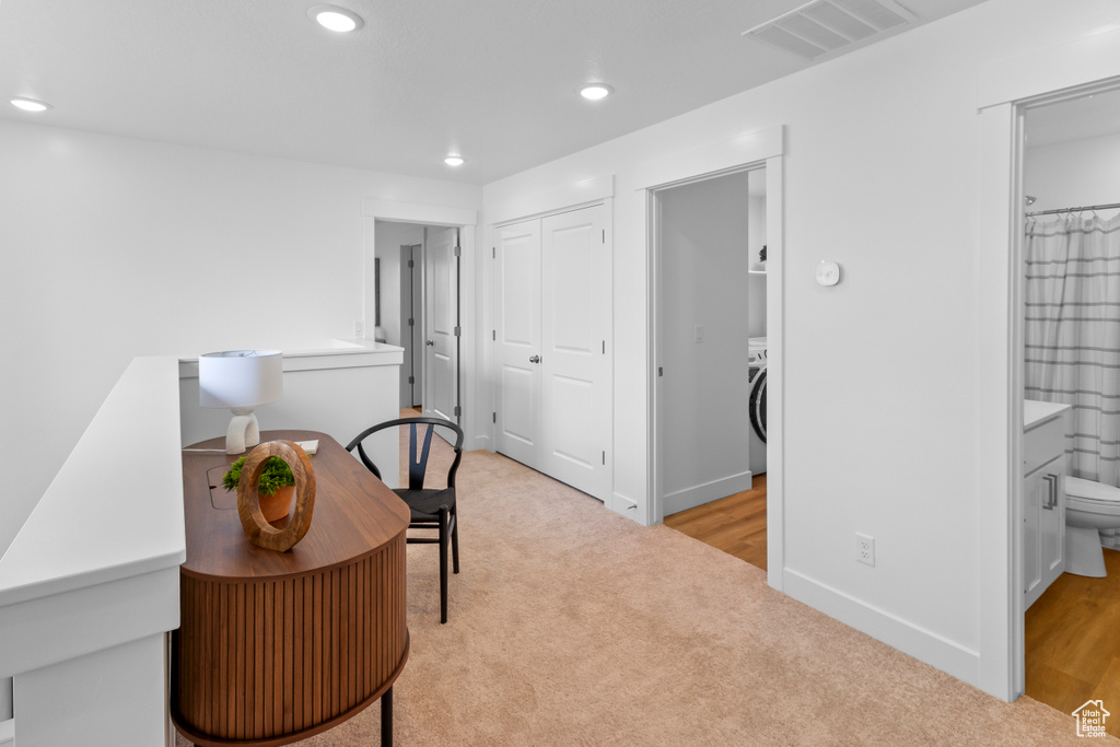 Office space with light colored carpet, recessed lighting, washer / clothes dryer, and baseboards