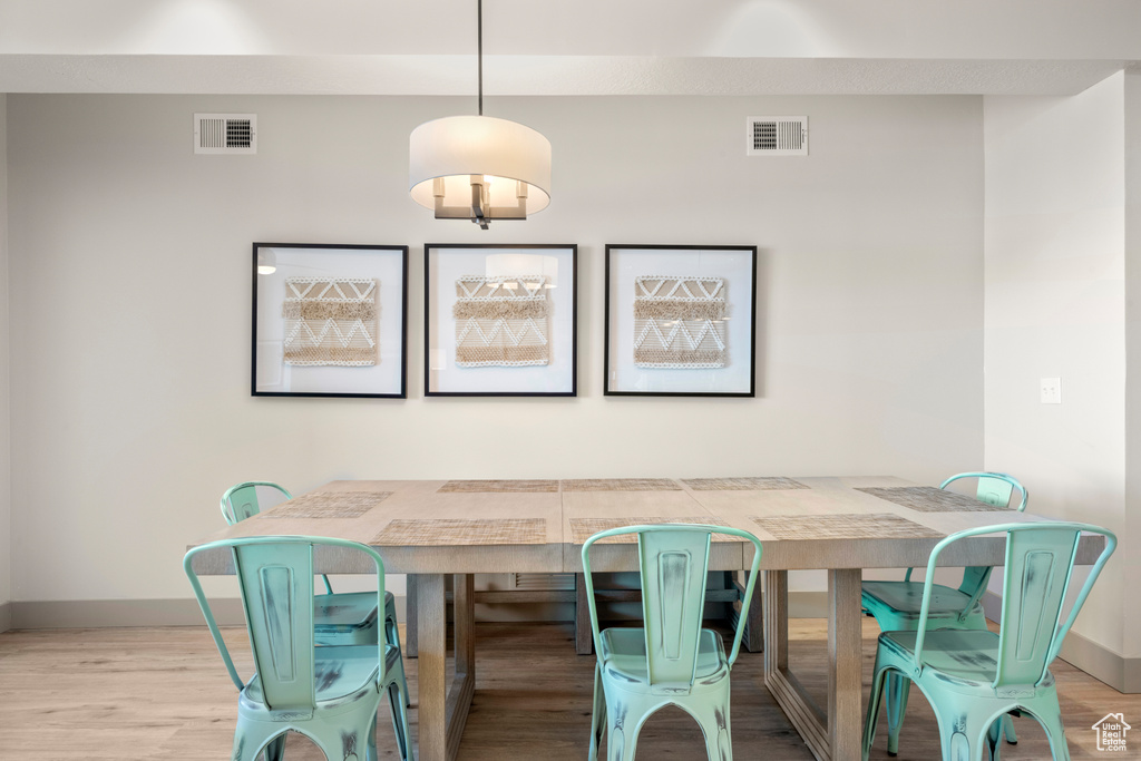 Dining room with baseboards and wood finished floors