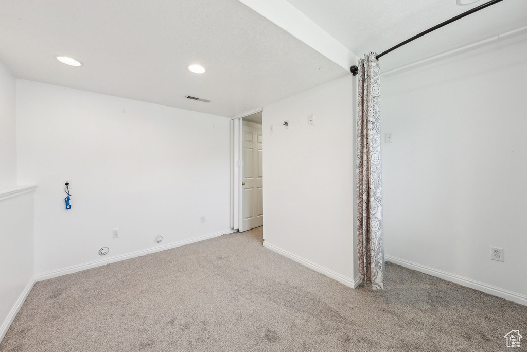 Unfurnished bedroom with carpet, recessed lighting, and baseboards
