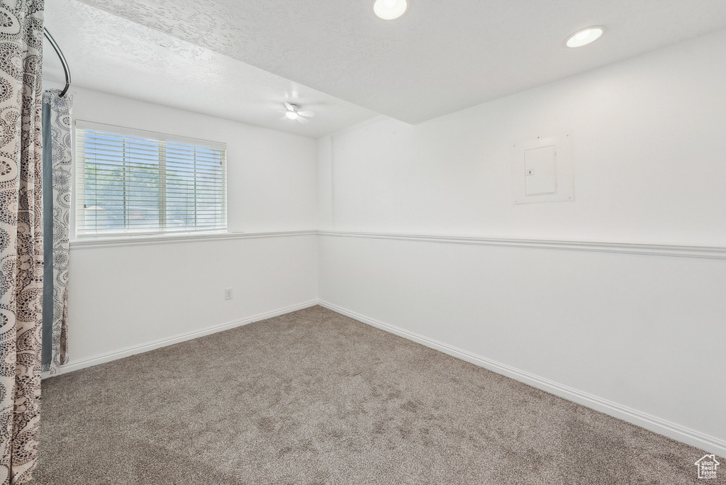 Unfurnished room with carpet flooring, baseboards, recessed lighting, and a textured ceiling