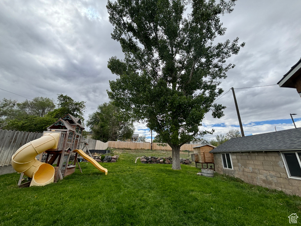 View of yard featuring a playground