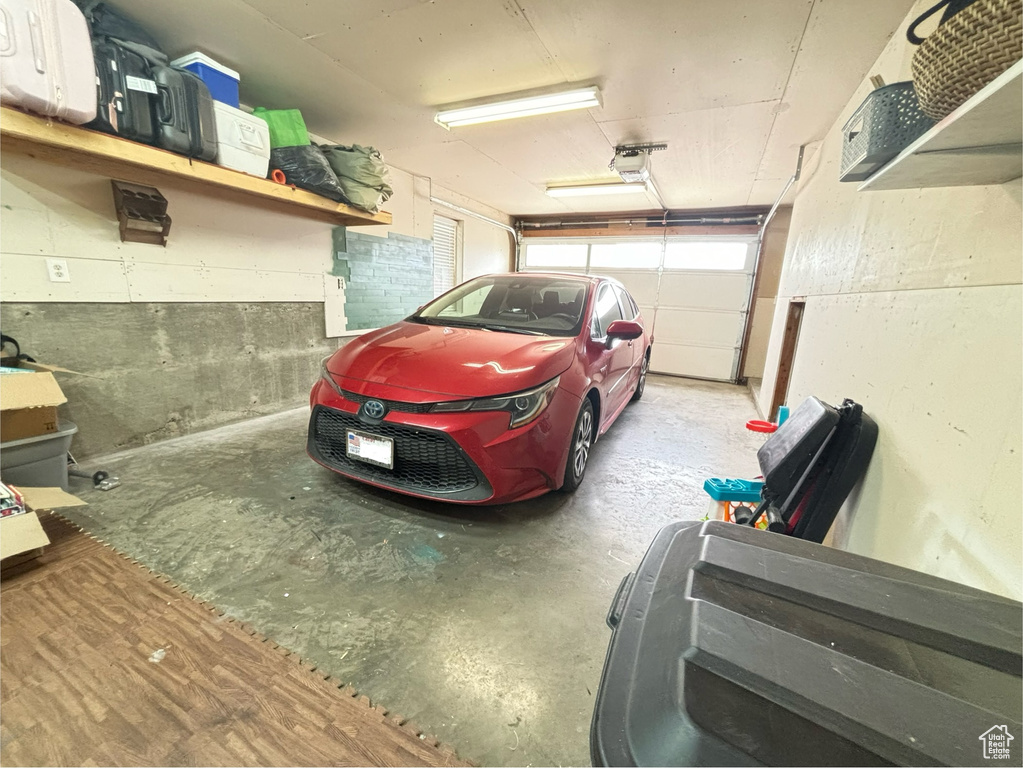 Garage featuring a garage door opener