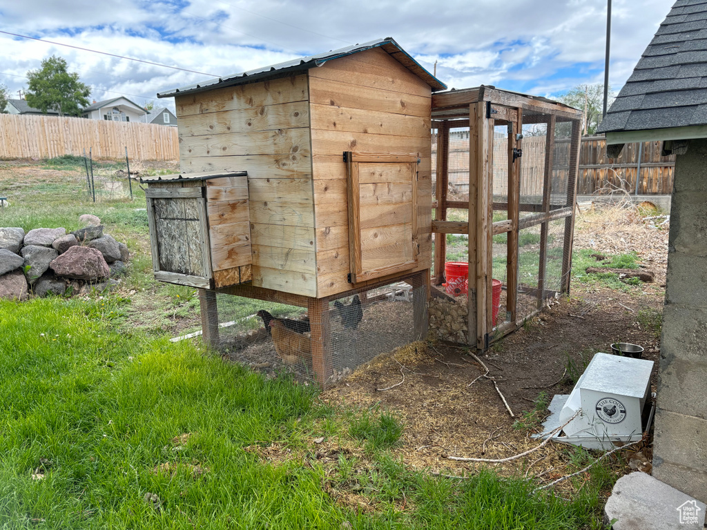View of poultry coop with fence