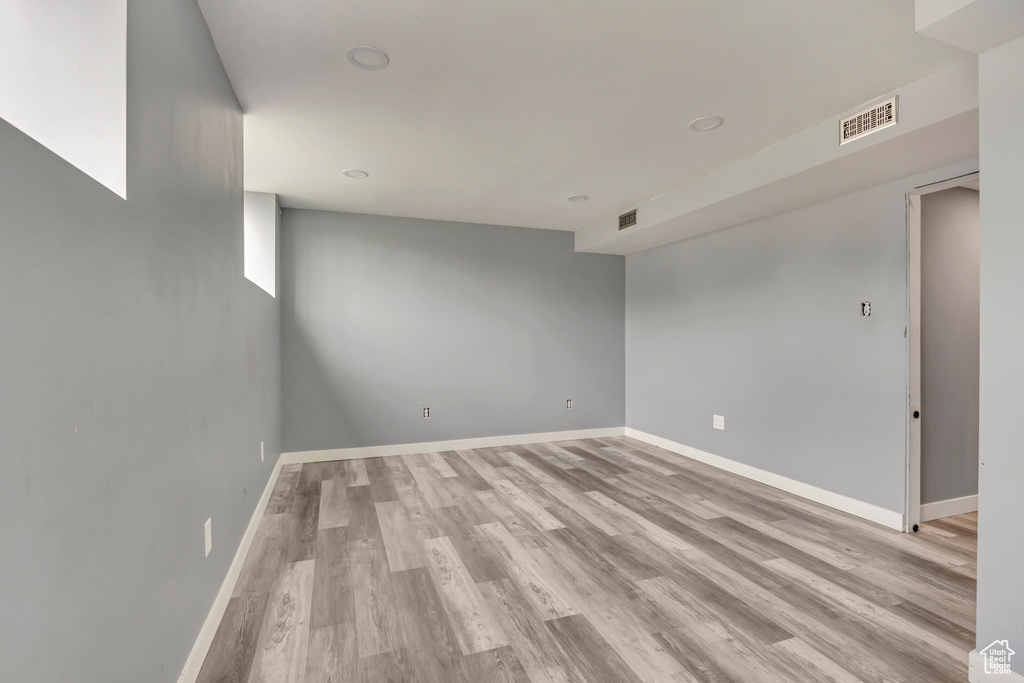 Spare room with light wood-style flooring and baseboards
