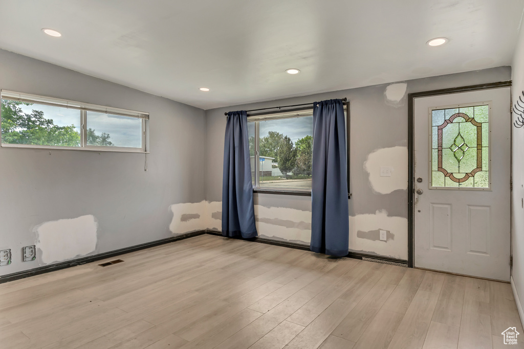 Entrance foyer featuring plenty of natural light, light wood-type flooring, and recessed lighting