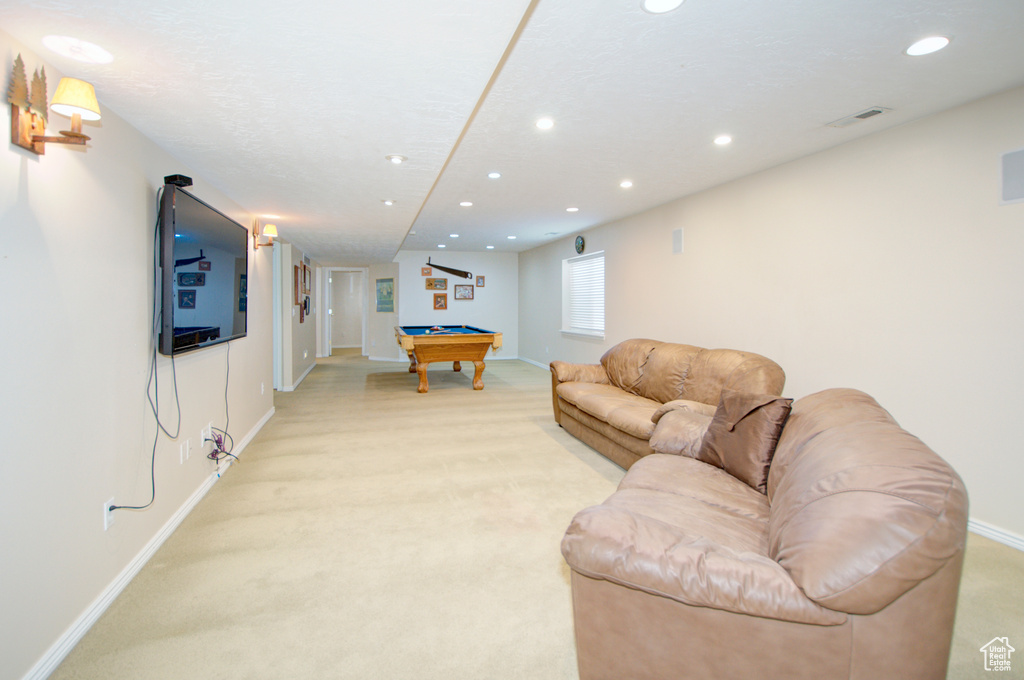 Living room with light carpet, baseboards, billiards, and recessed lighting