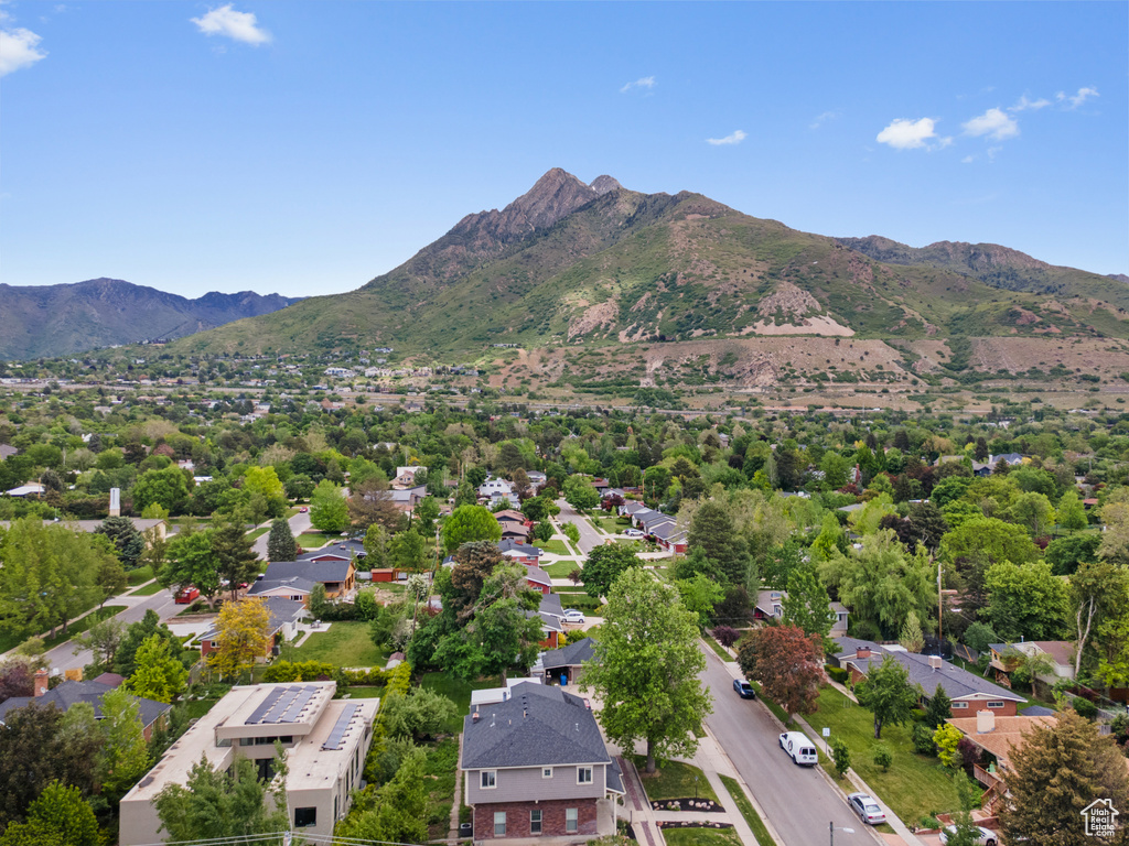 Aerial view of residential area featuring a mountain backdrop