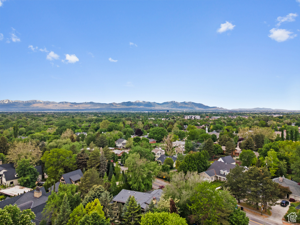 Aerial view of residential area featuring a mountainous background