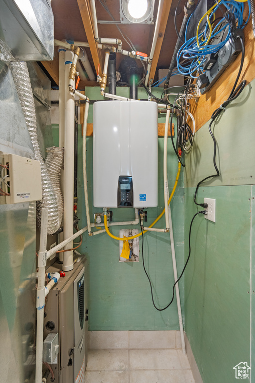 Utility room featuring water heater