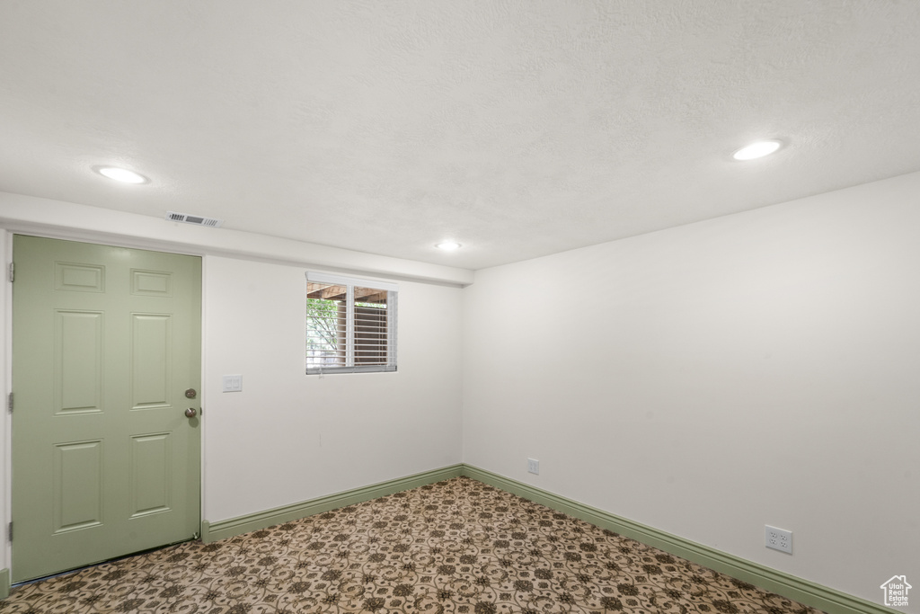 Unfurnished room with baseboards, tile patterned floors, and recessed lighting