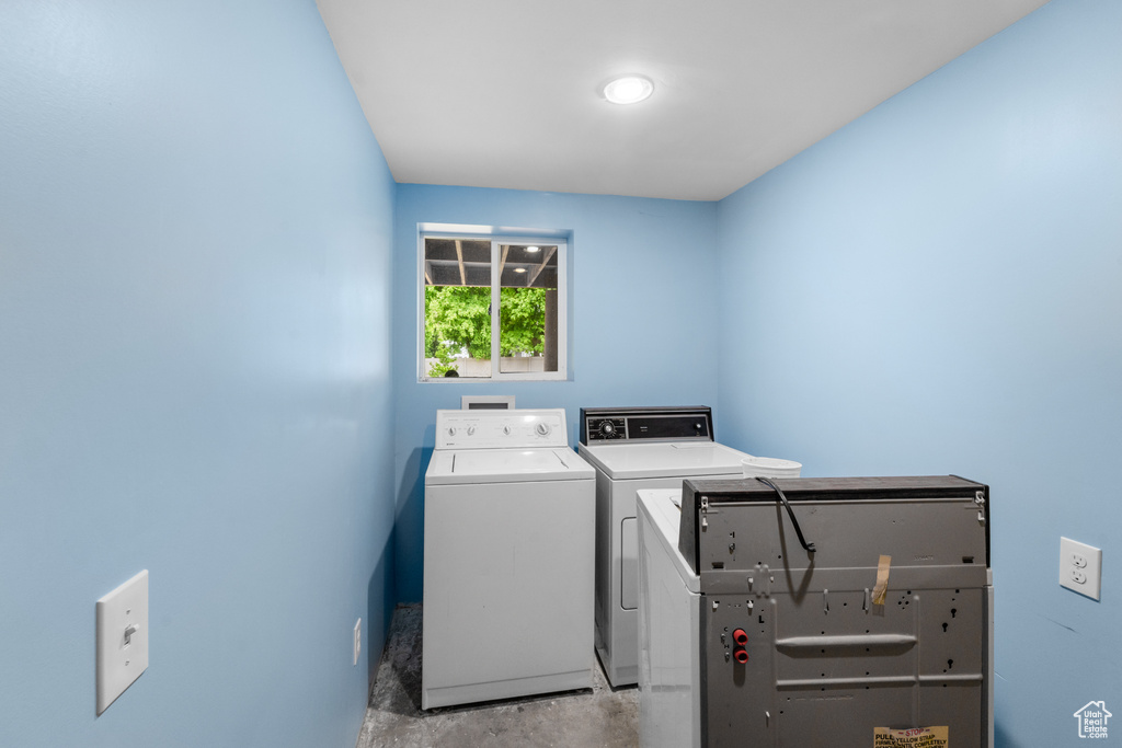 Laundry room featuring separate washer and dryer