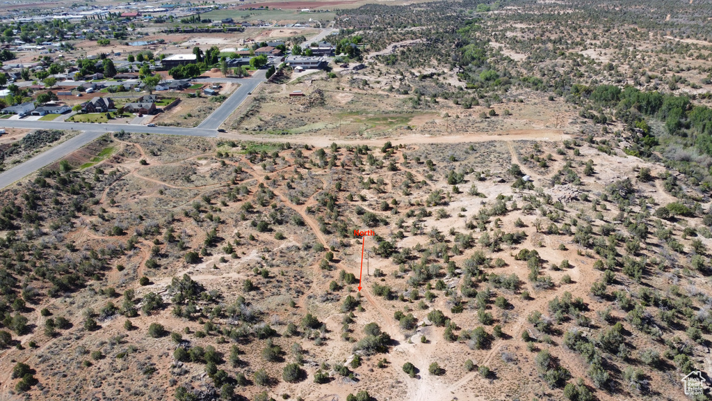 Aerial view of property and surrounding area with a desert landscape and rural landscape
